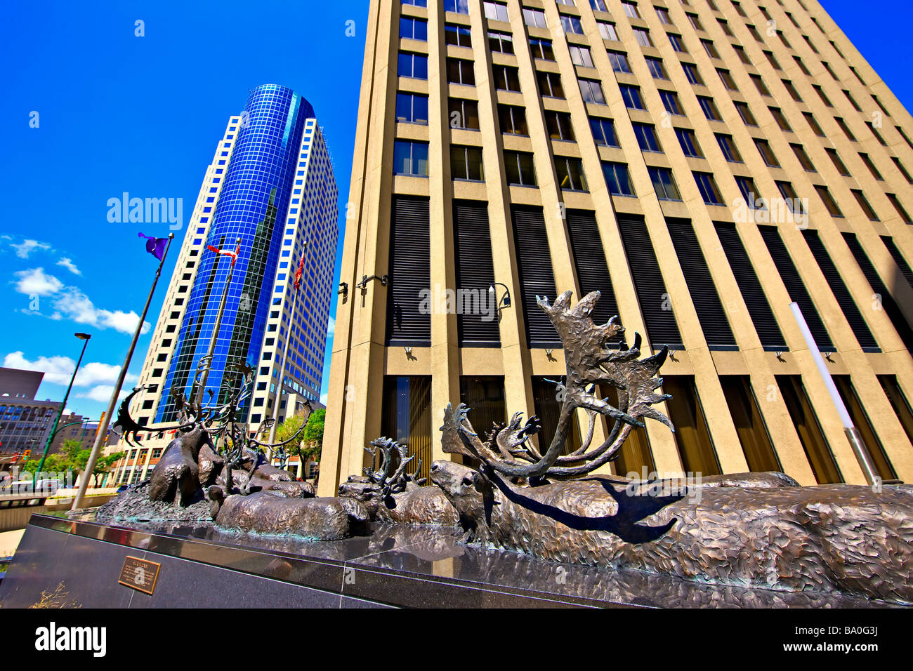 Bronze sculpture of caribous crossing a river,titled "Seal River Crossing" outside the Richardson Building. Stock Photo