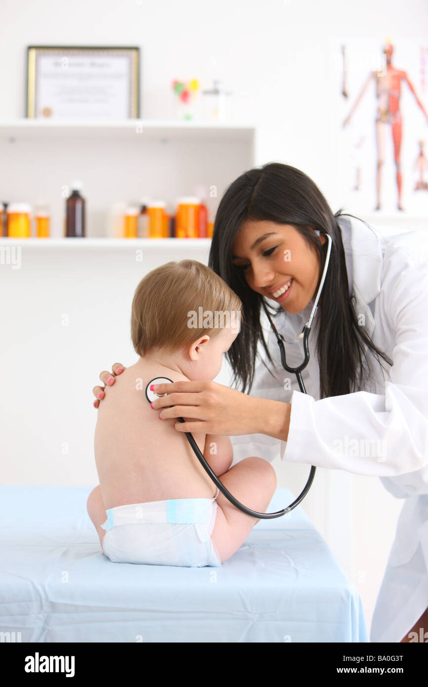 Pediatrician checking baby s heart beat with stethoscope Stock Photo