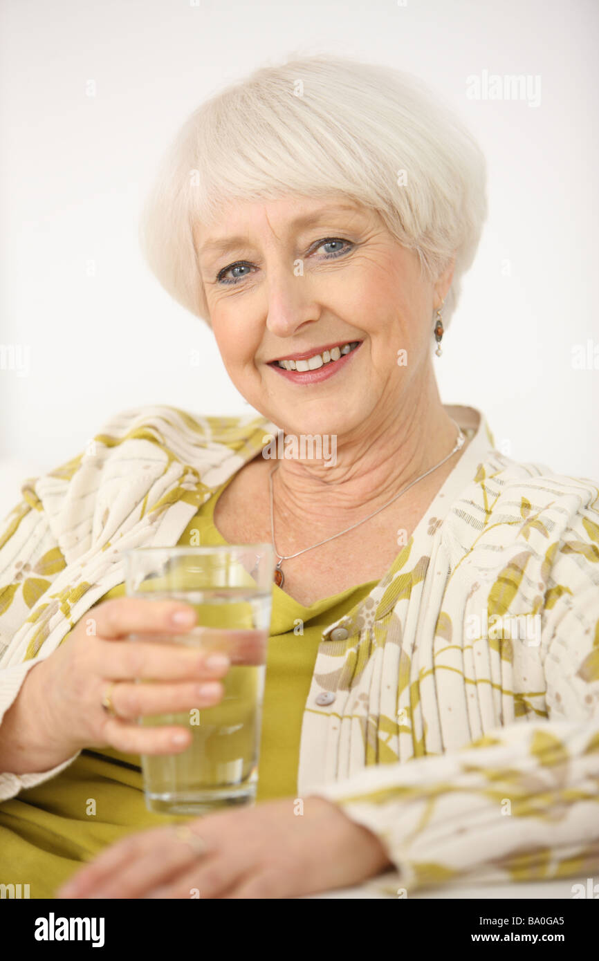 Senior woman with glass of water Stock Photo