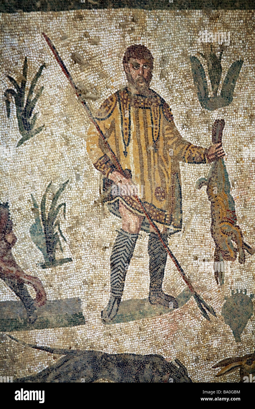 Hunter with spear holding hare mosaic Room of Small Hunt Villa Romana ...