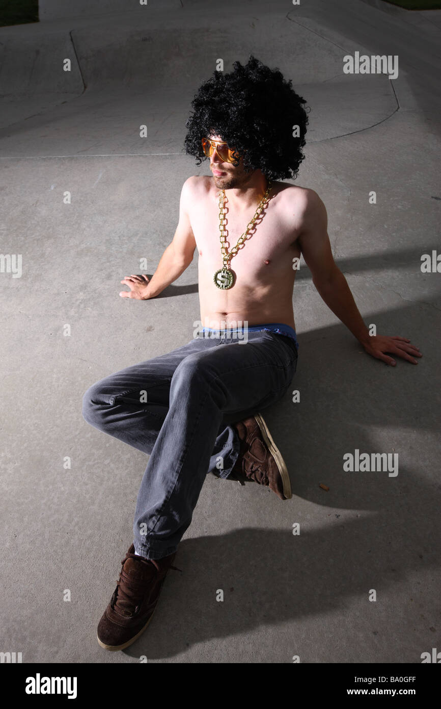 Man wearing afro wig and bling Stock Photo