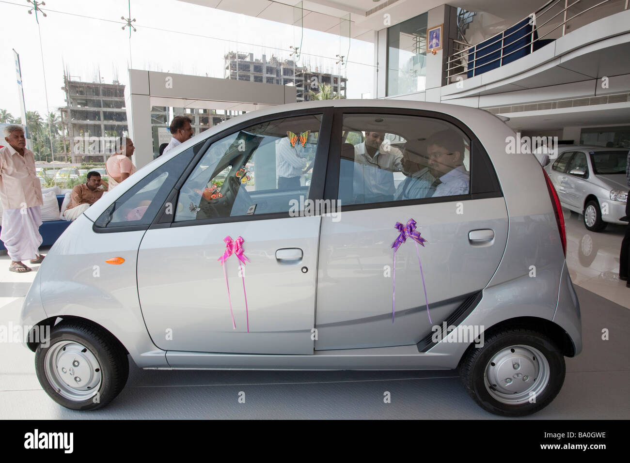 the new Tata car the Nano has been release in the shop of india and indian people seems to be really interresting by this low cost car 2000 Euros than will come soon on the western market Stock Photo