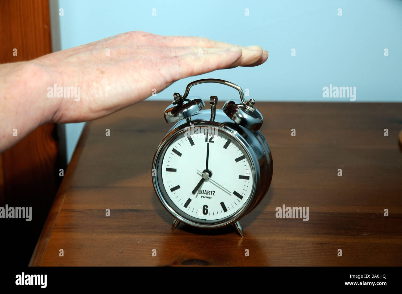 Alarm Clock Womans Hand Switching An Early Morning Alarm Off Alarm Clock Womans Hand Switching An Early Morning Alarm Off