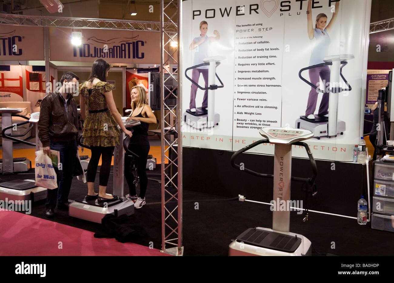 Stand displaying exercise equipment, based on shaking the body to build muscle. Ideal Home Show Exhibition, Earls Court. London Stock Photo