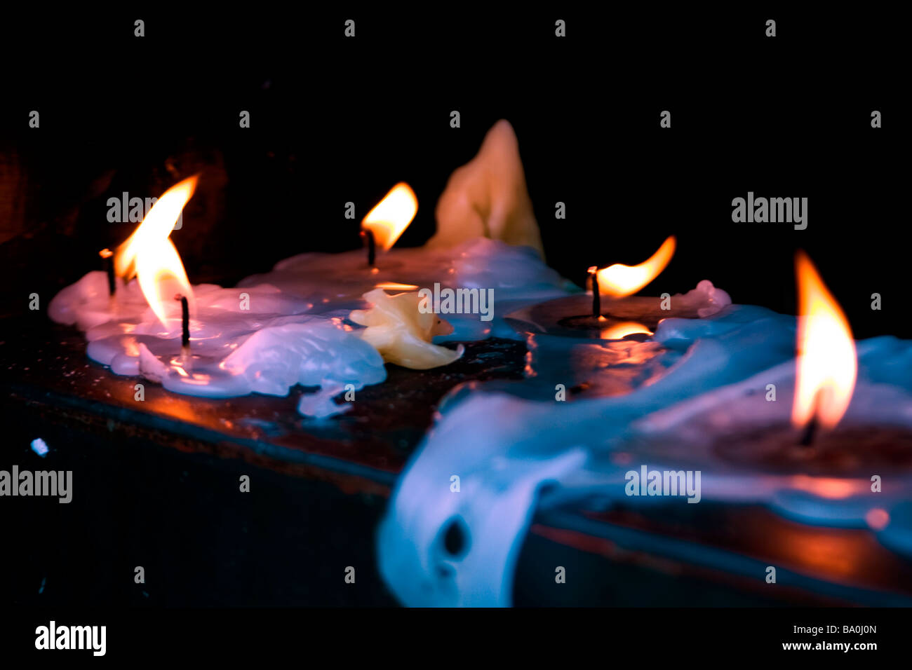 last of candles burning Stock Photo Alamy