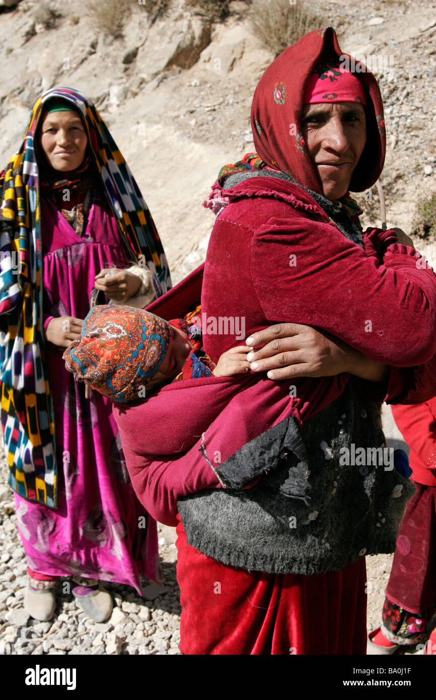 Tajik women with baby wearing traditional dress and hat, Marguzor Lakes,  Fan Mountain, Tajikistan, Central Asia Stock Photo - Alamy