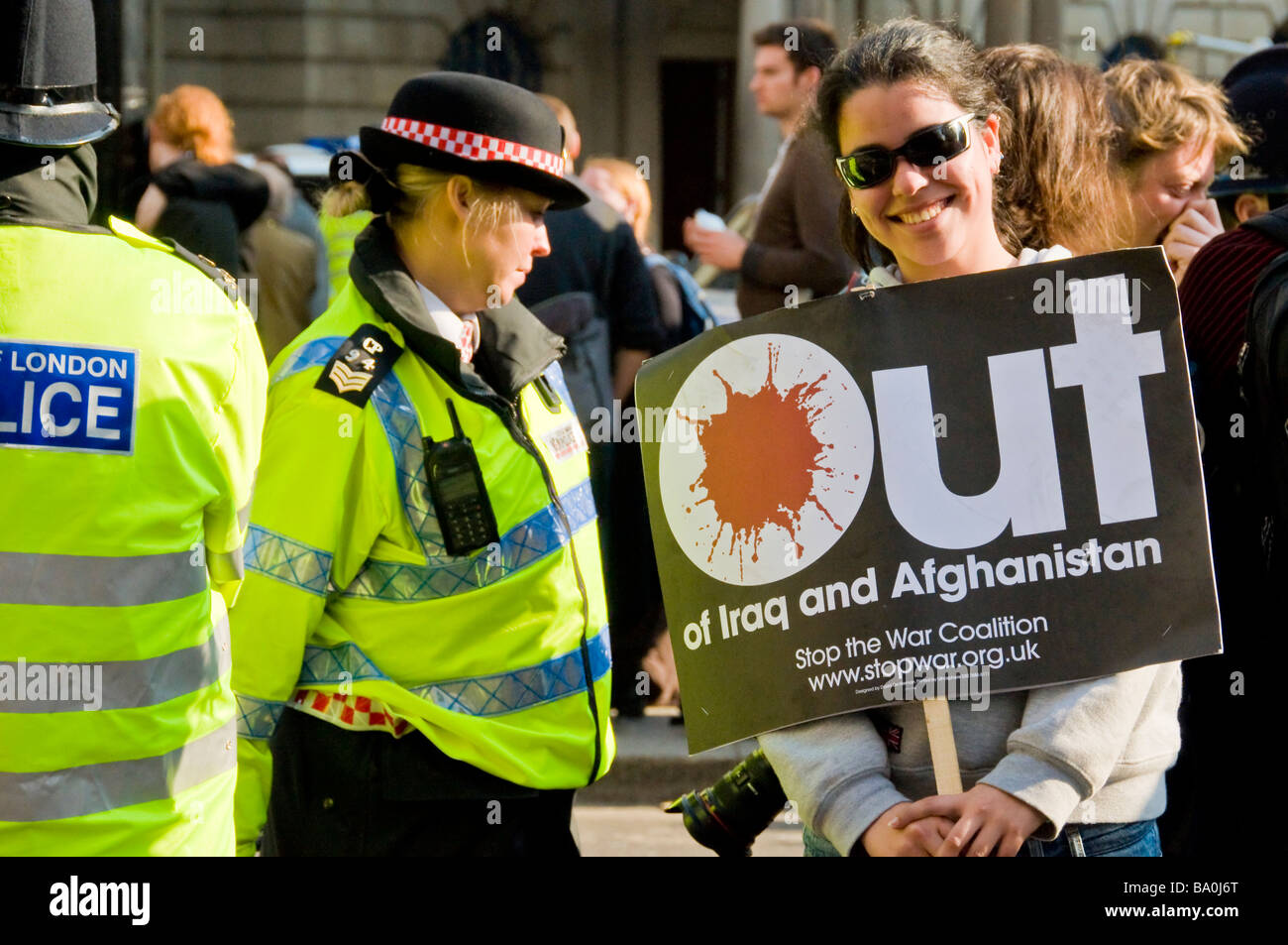A Young Girl Protester Posing With An Anti War Banner And A Stock