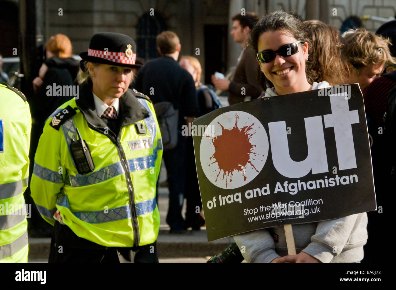 A Young Girl Protester Posing With An Anti War Banner And A Stock