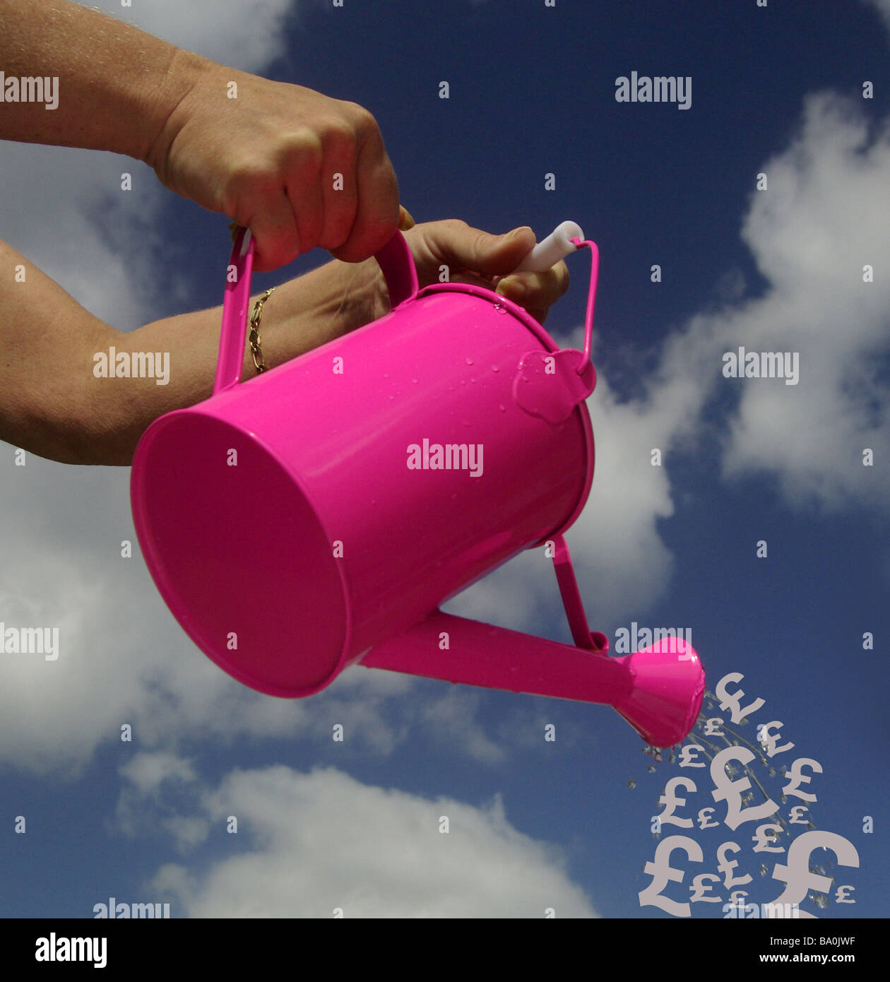 Watering can with UK pound/Sterling graphic and sky background, Brexit concept Stock Photo
