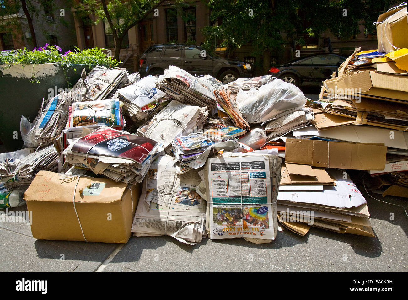 Cardboard newspapers and magazines bundled for curbside recycling