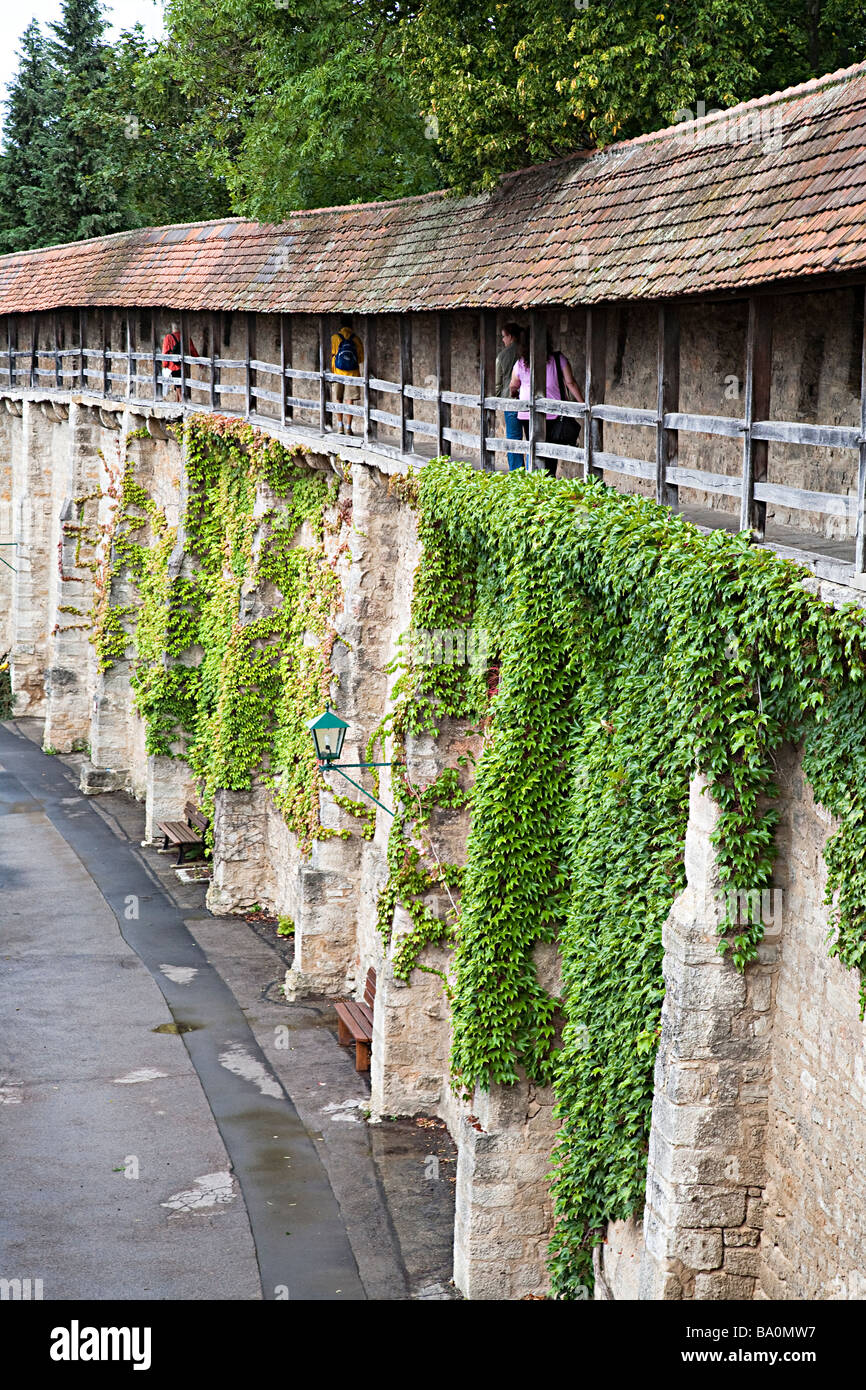 People walking on town wall Rothenburg Germany Stock Photo