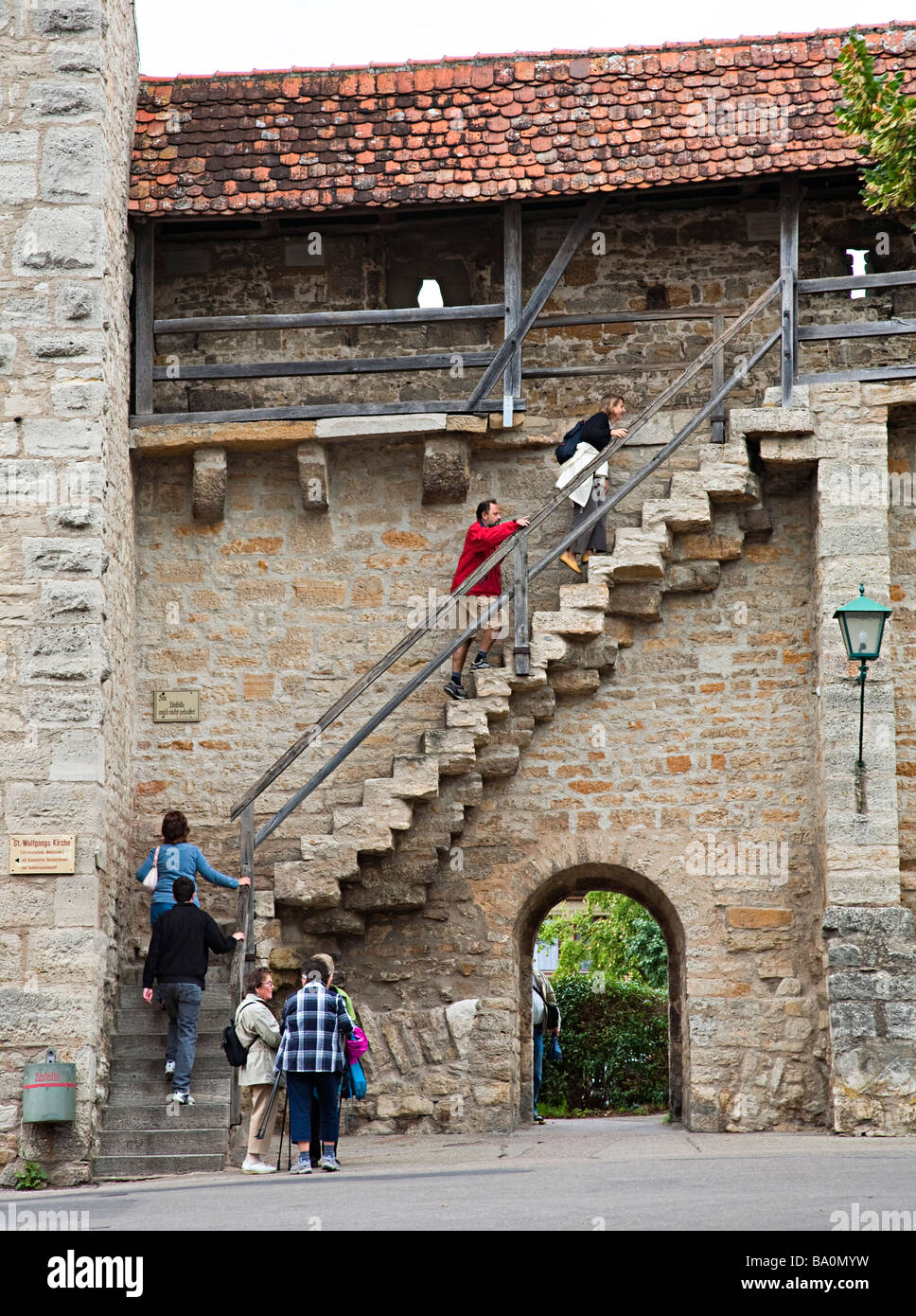 People climbing steps to town wall Rothenburg Germany Stock Photo