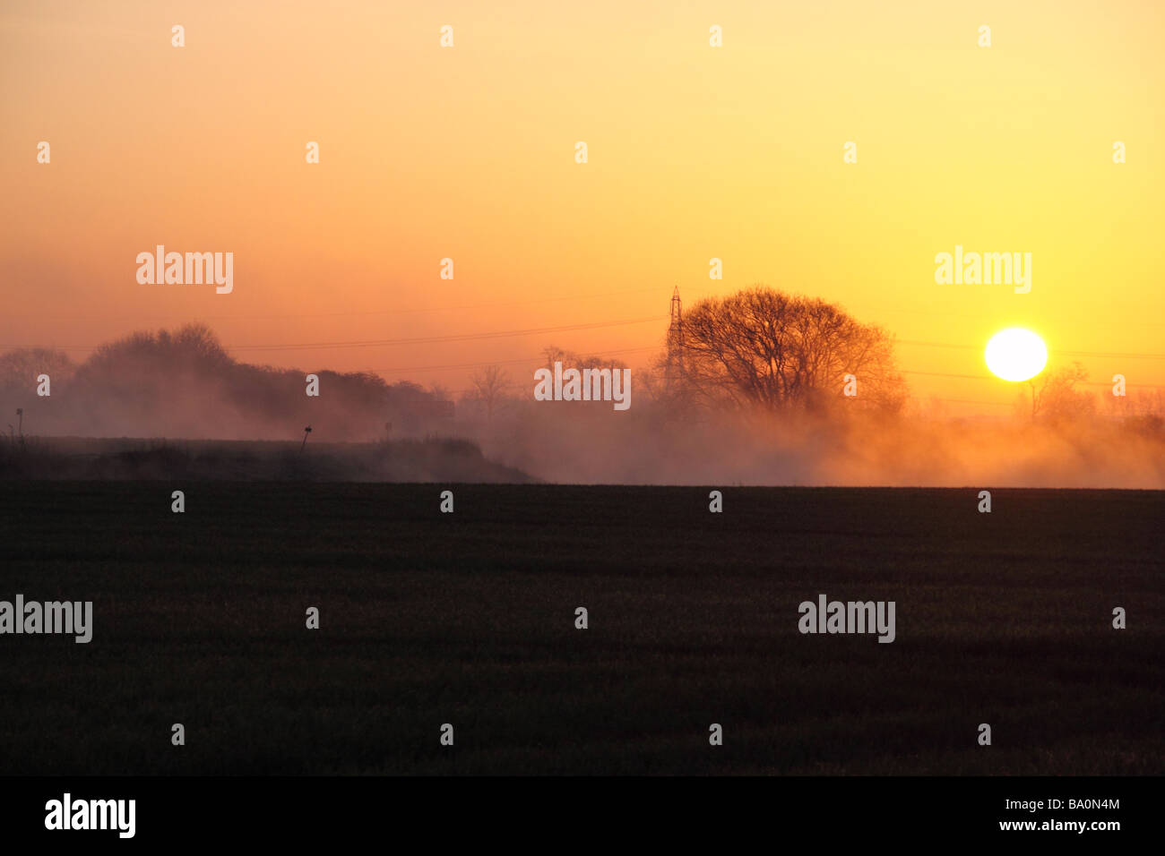 sunrise over the river trent in nottinghamshire with the mist rising off the water Stock Photo