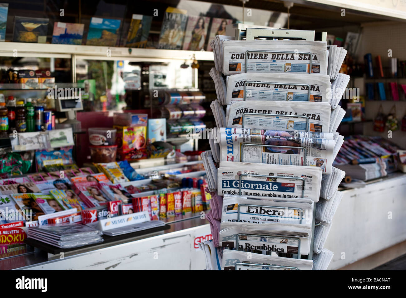 Italian newspapers neatly stacked in tiers at a kiosk in Lugano, Ticino, Switzerland Stock Photo