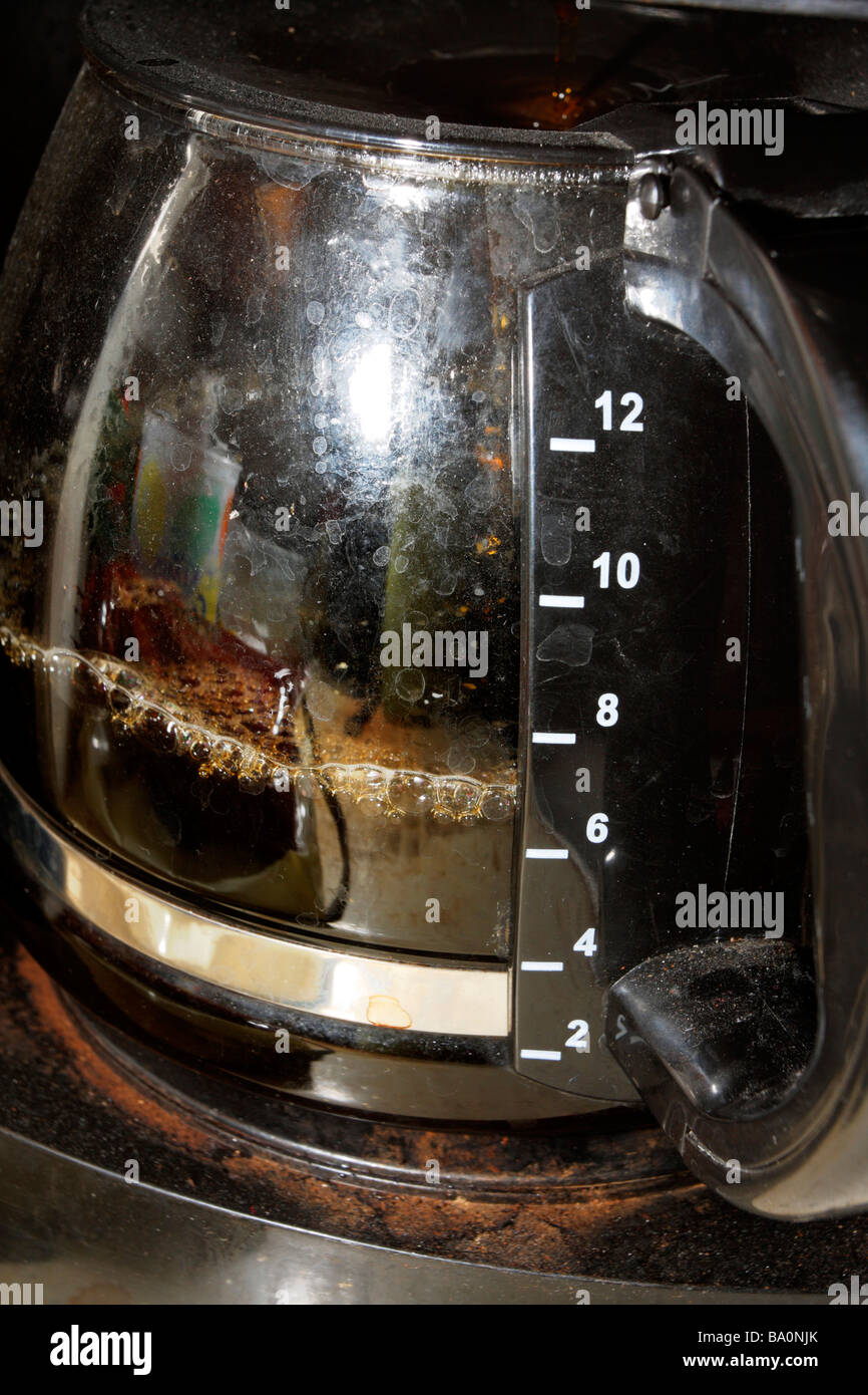 Coffeepot with coffee, well used dirty soiled spotted well loved Stock Photo