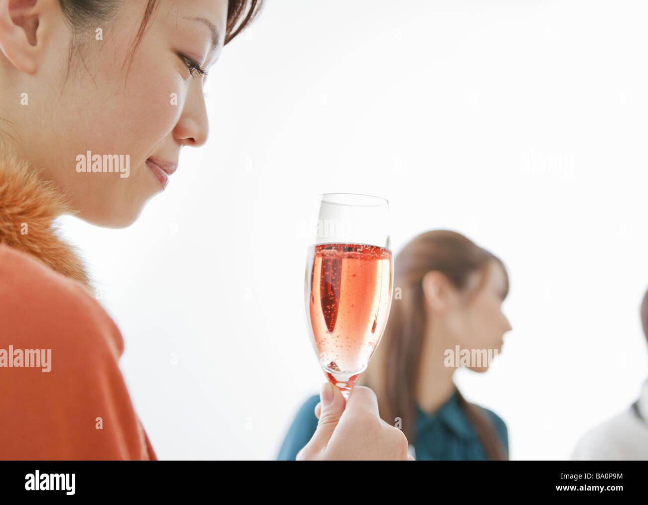 Woman holding a glass of champagne Stock Photo