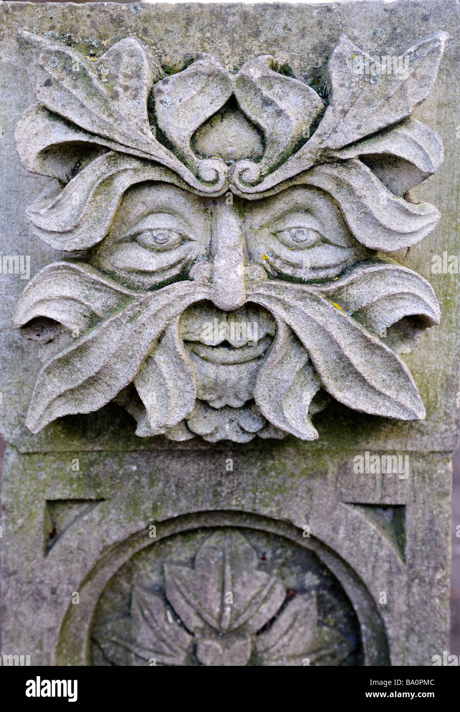'Green Man' stone carving face at St Mary de Crypt church Gloucester UK Stock Photo