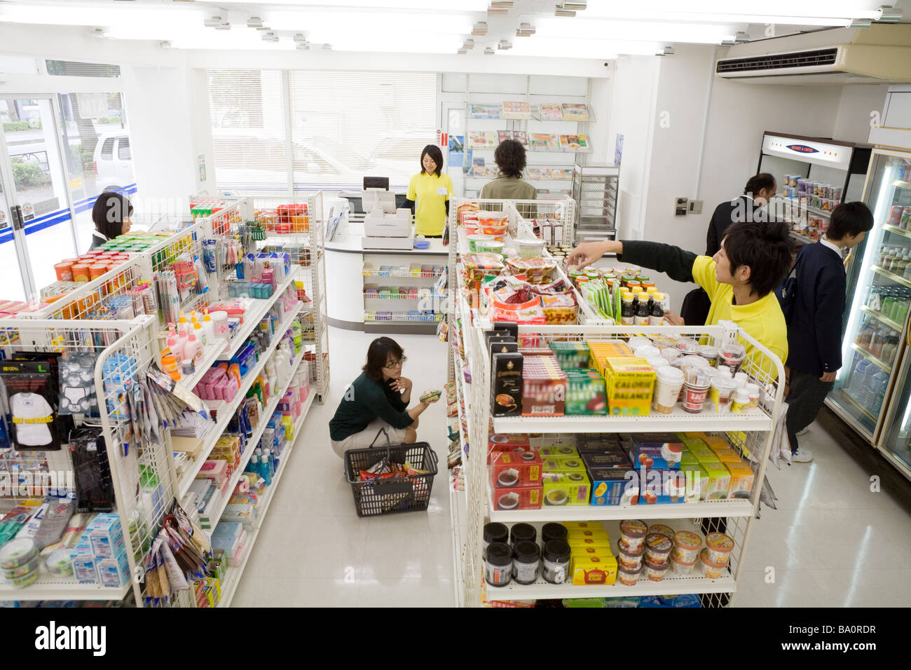 Clerk and customer at convenience store Stock Photo. 