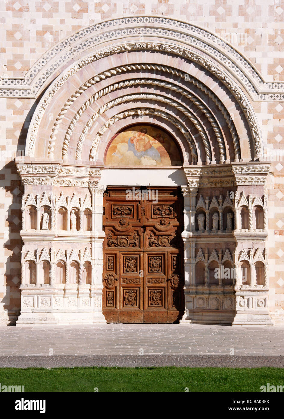 detail of pink and white stone basilica of the 13th century Santa Maria di Collemaggio in L'Aquila,Abruzzo,earthquake damaged Stock Photo