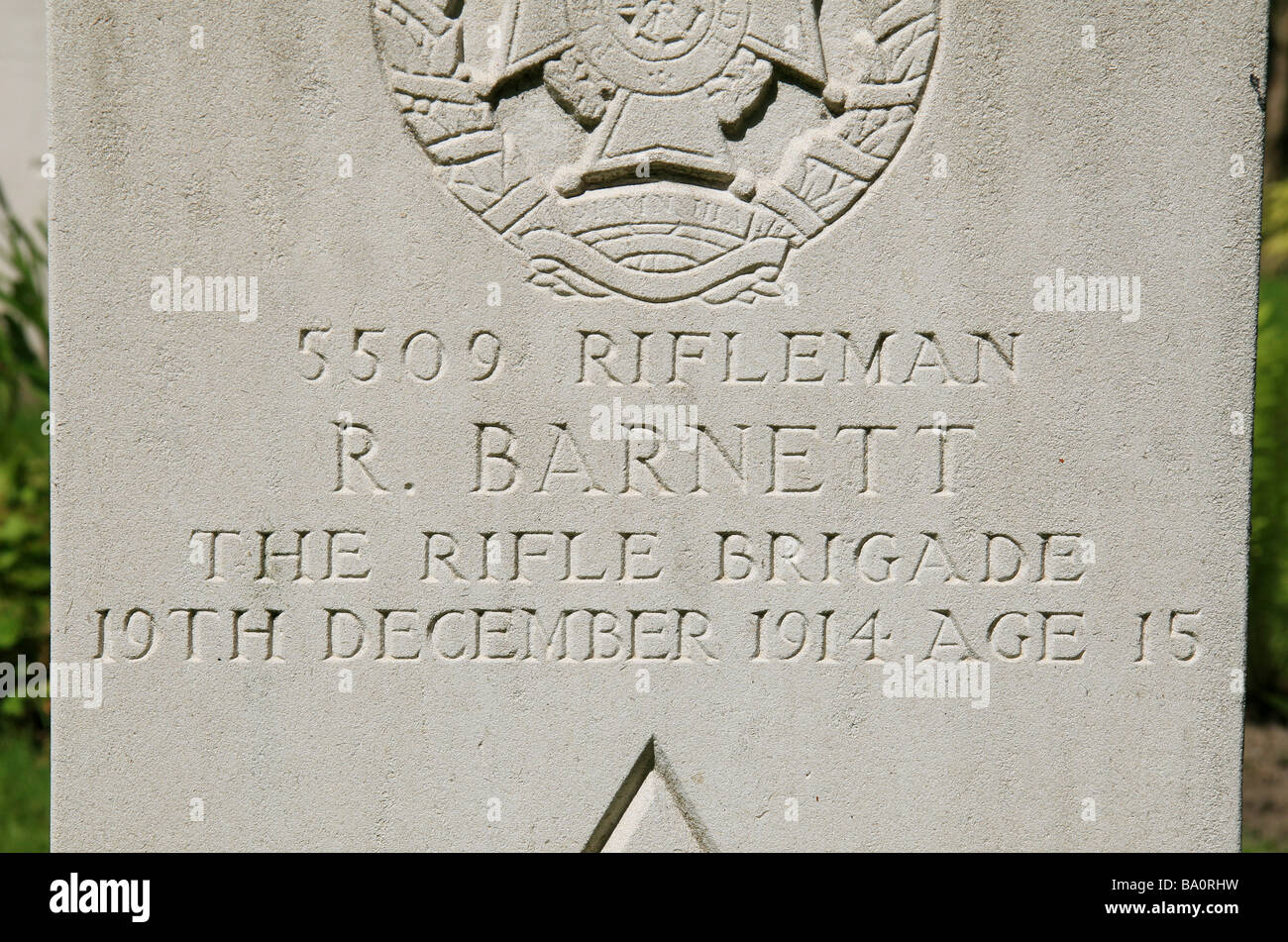 The headstone for Rifleman R Barnett, Rifle House CWGC Cemetery Waasten, Belgium, who died in World War I aged 15. Stock Photo
