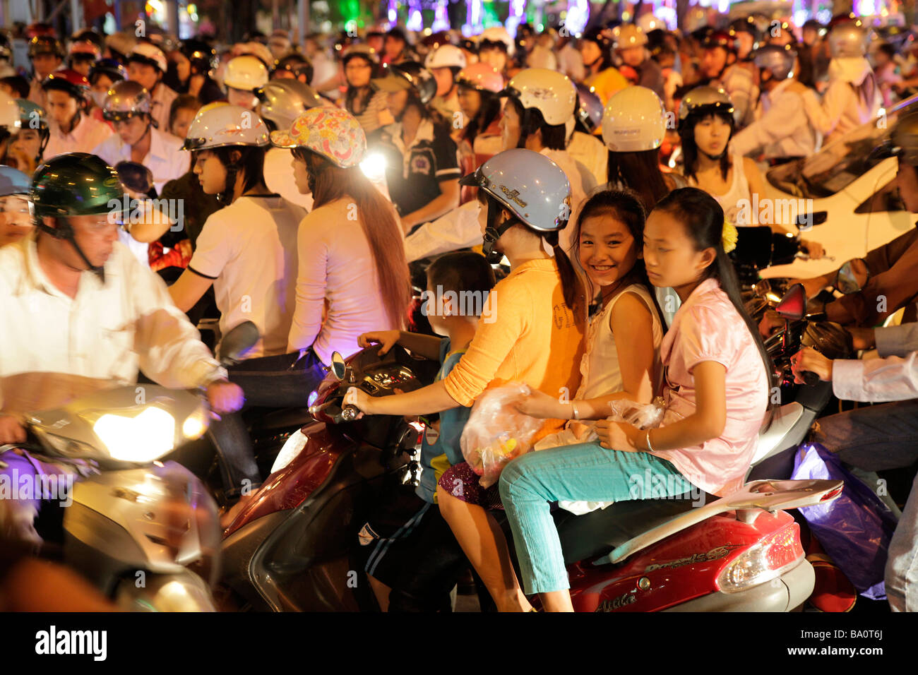 vietnamese family on a scooter in Saigon Ho Chi Minh City Vietnam Stock Photo