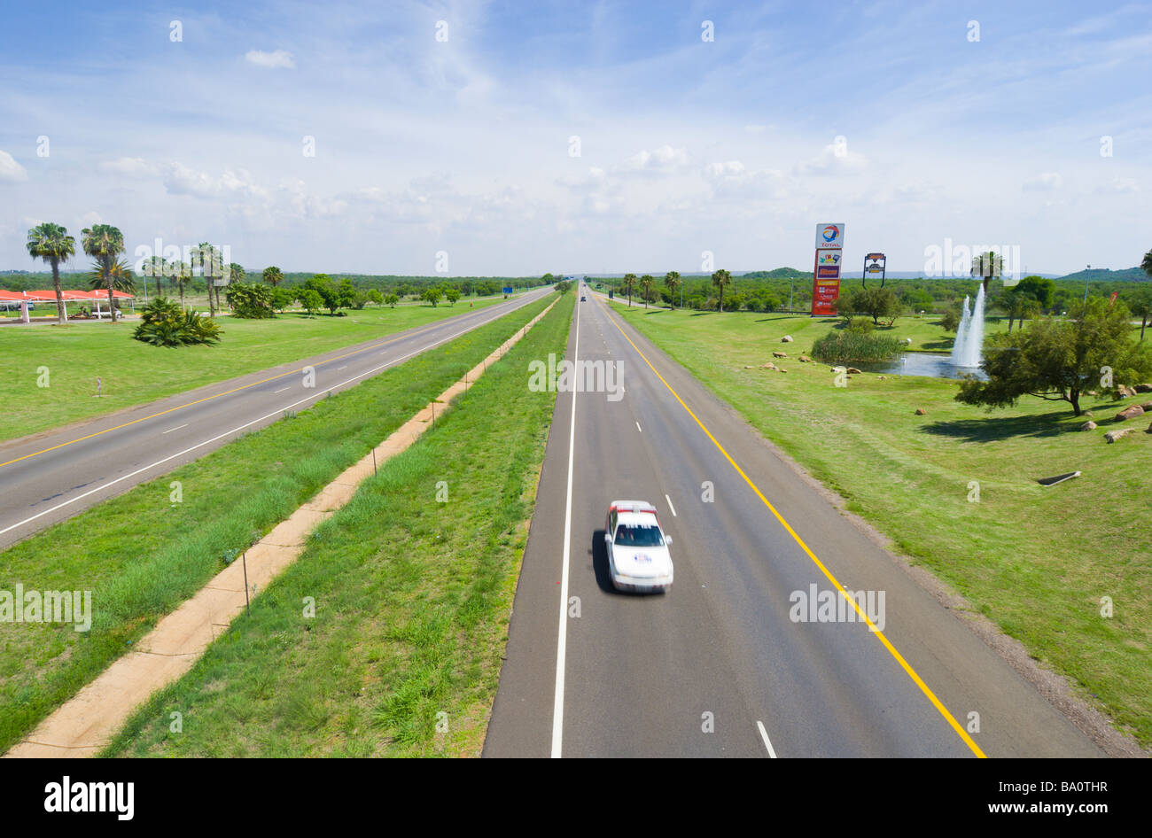 A speeding police car photographed from an overpass on South Africa's N1 highway Stock Photo