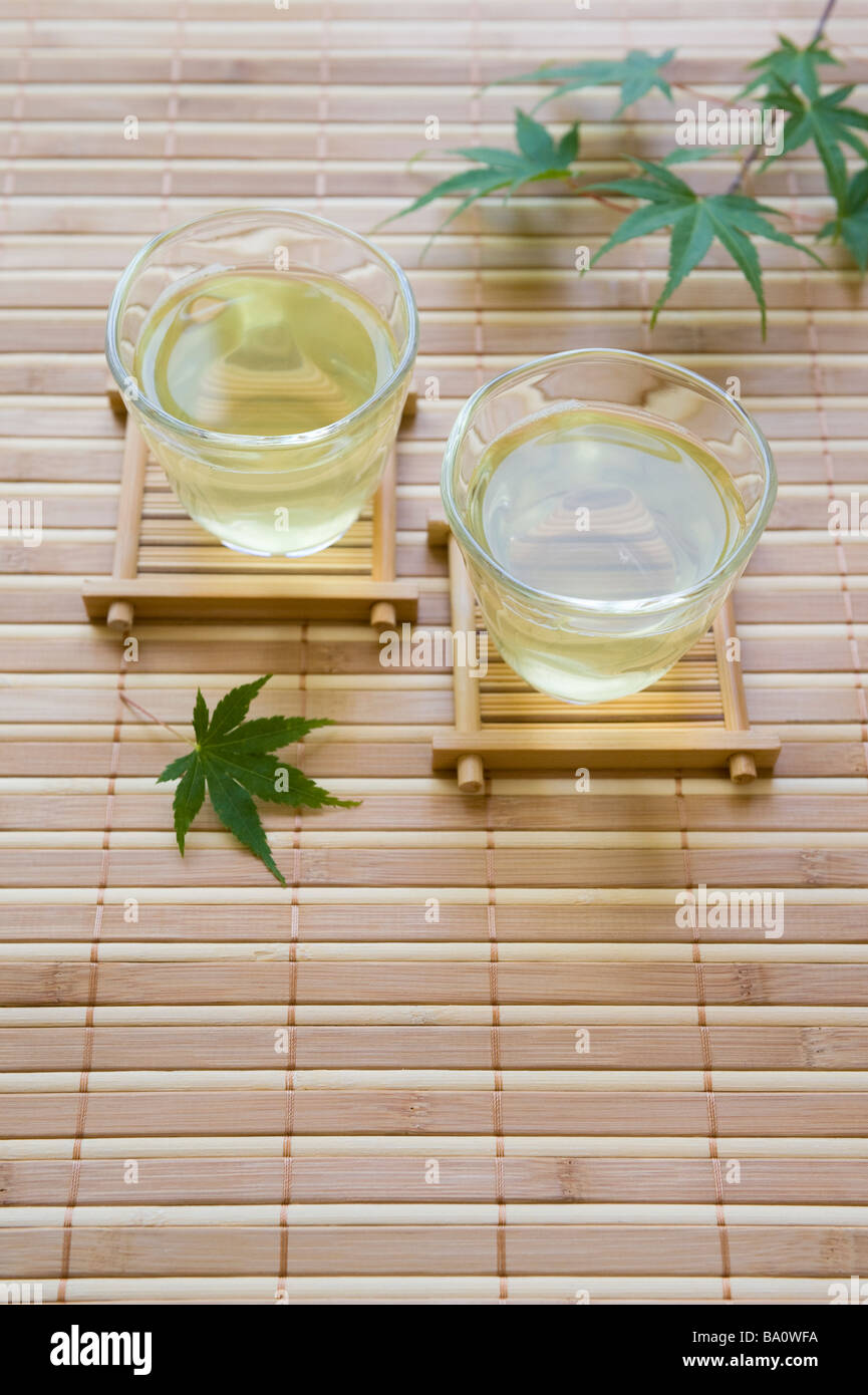 Green tea and maple leaf Stock Photo