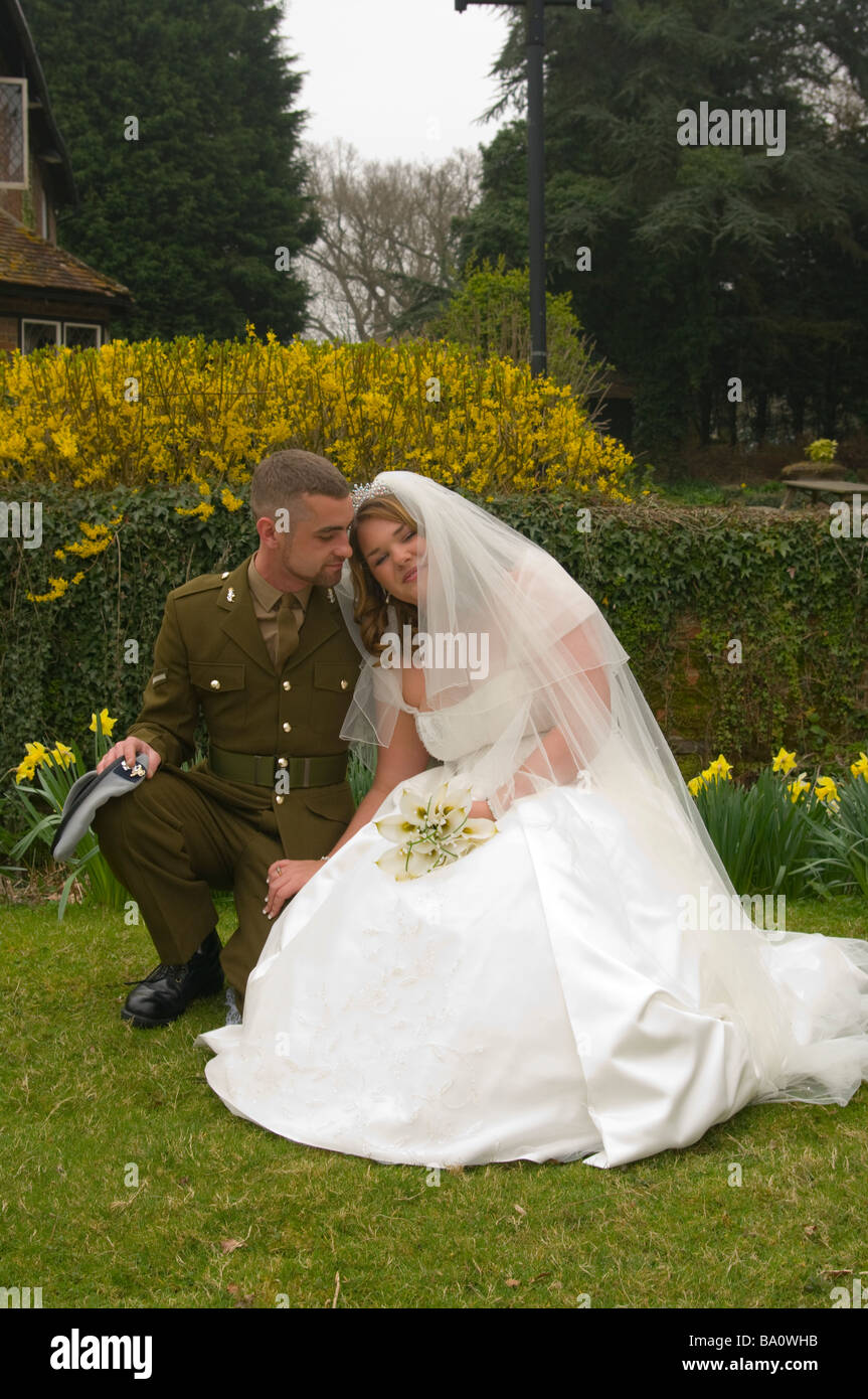 Bride and Groom in Army Uniform military armed forces wedding Stock Photo