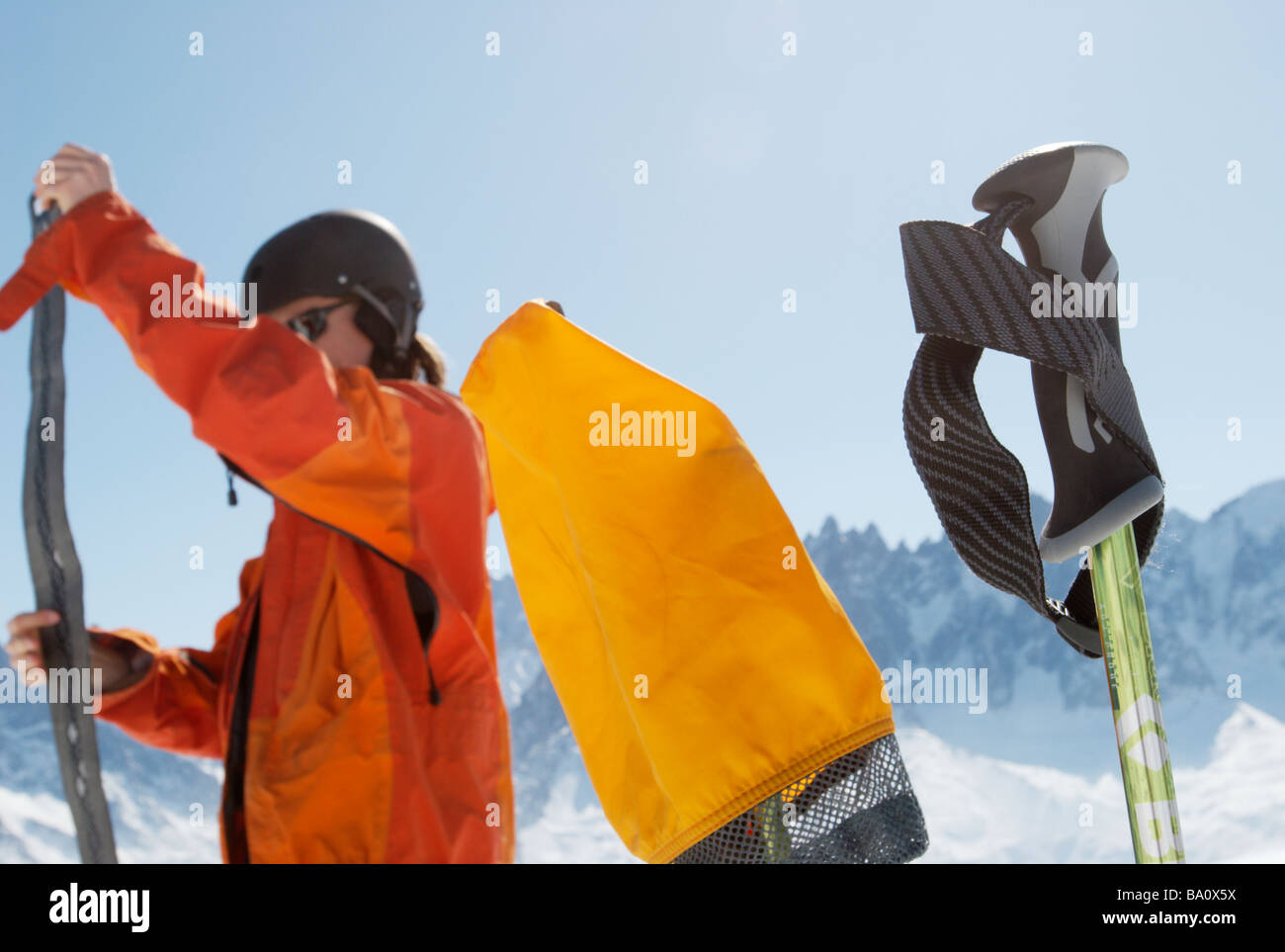 Ski tourer adjusting climbing skins for skis Stock Photo