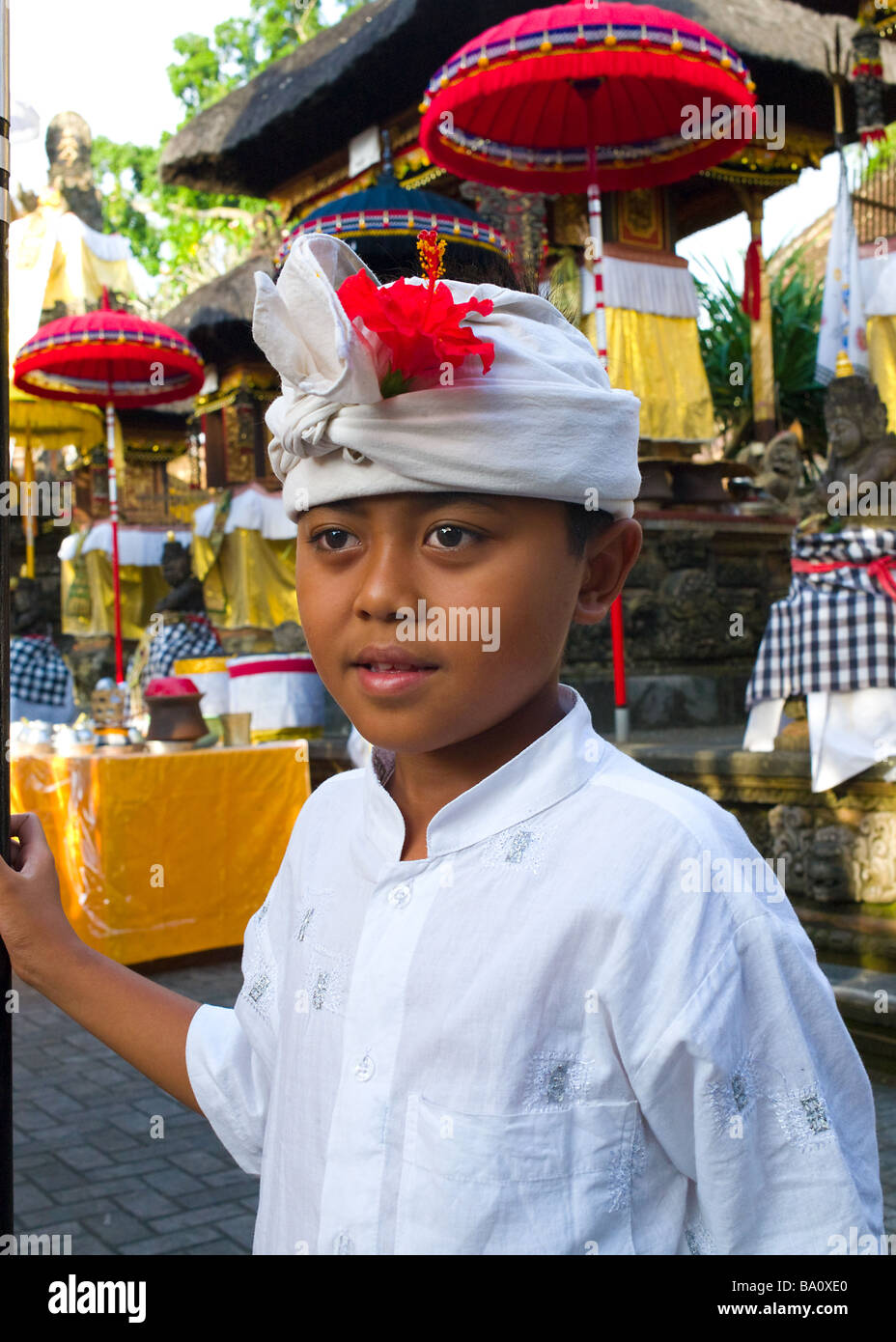 A boy at a Hindu Temple Ceremony - Ubud, Bali, Indonesia Stock Photo