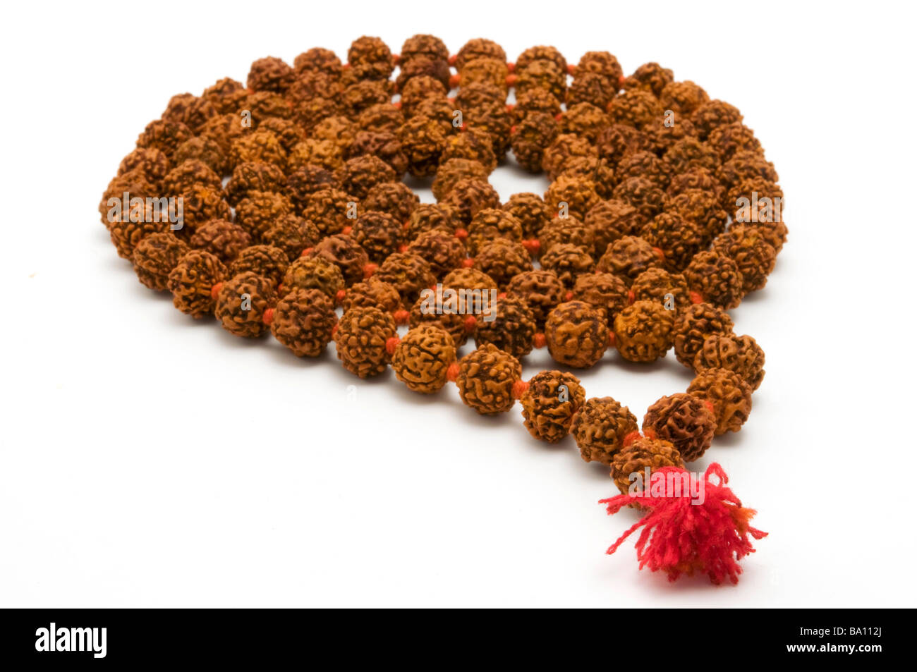 Japa Mala set of beads commonly used by Hindus and Buddhists on a white background Stock Photo