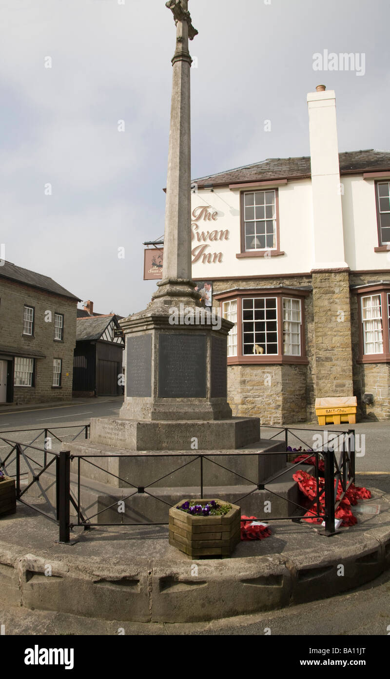 Kington Herefordshire England UK March The village war memorial in front of the historic Swan