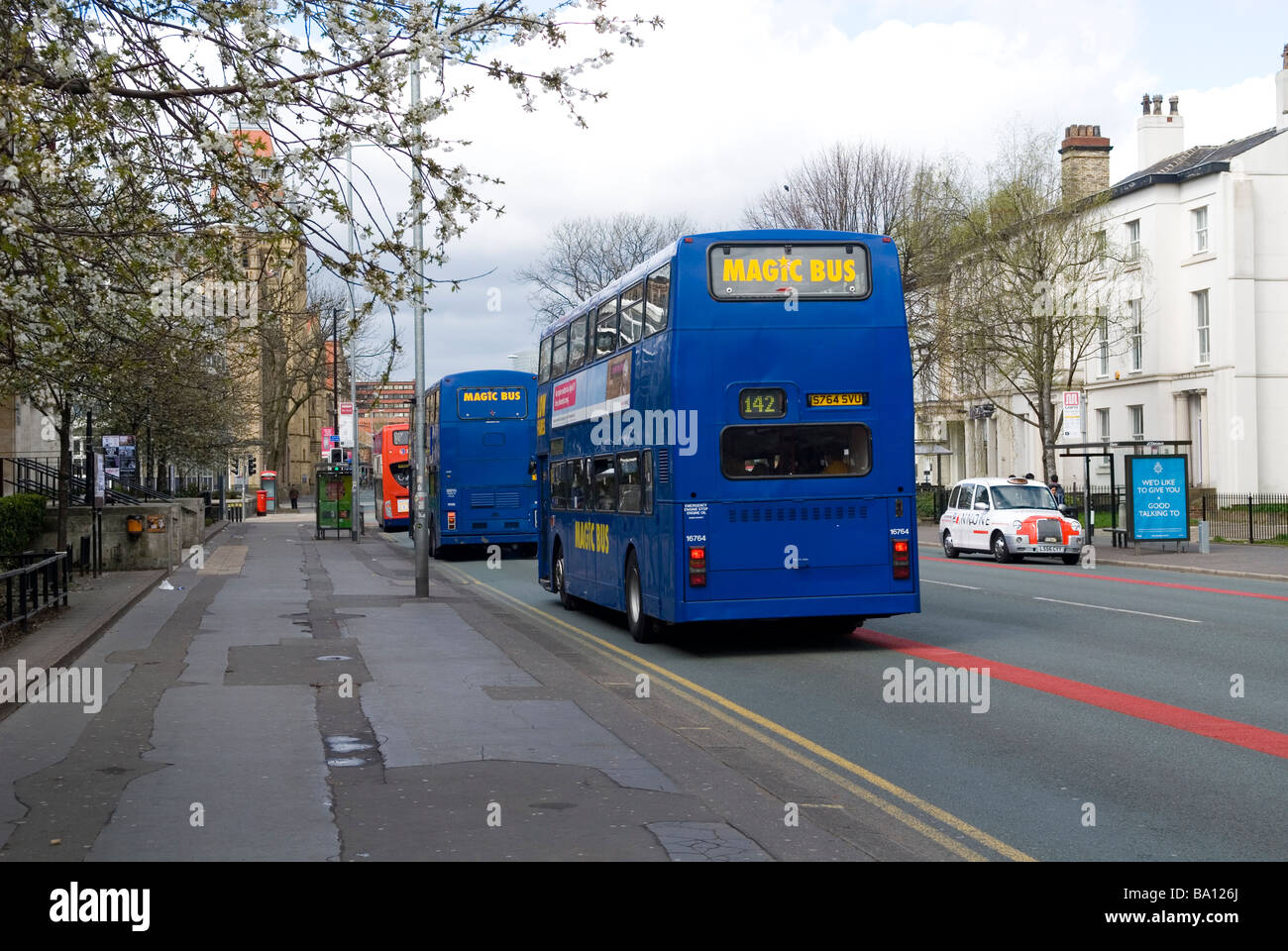Rear view of buses in Manchester city centre UK Stock Photo - Alamy