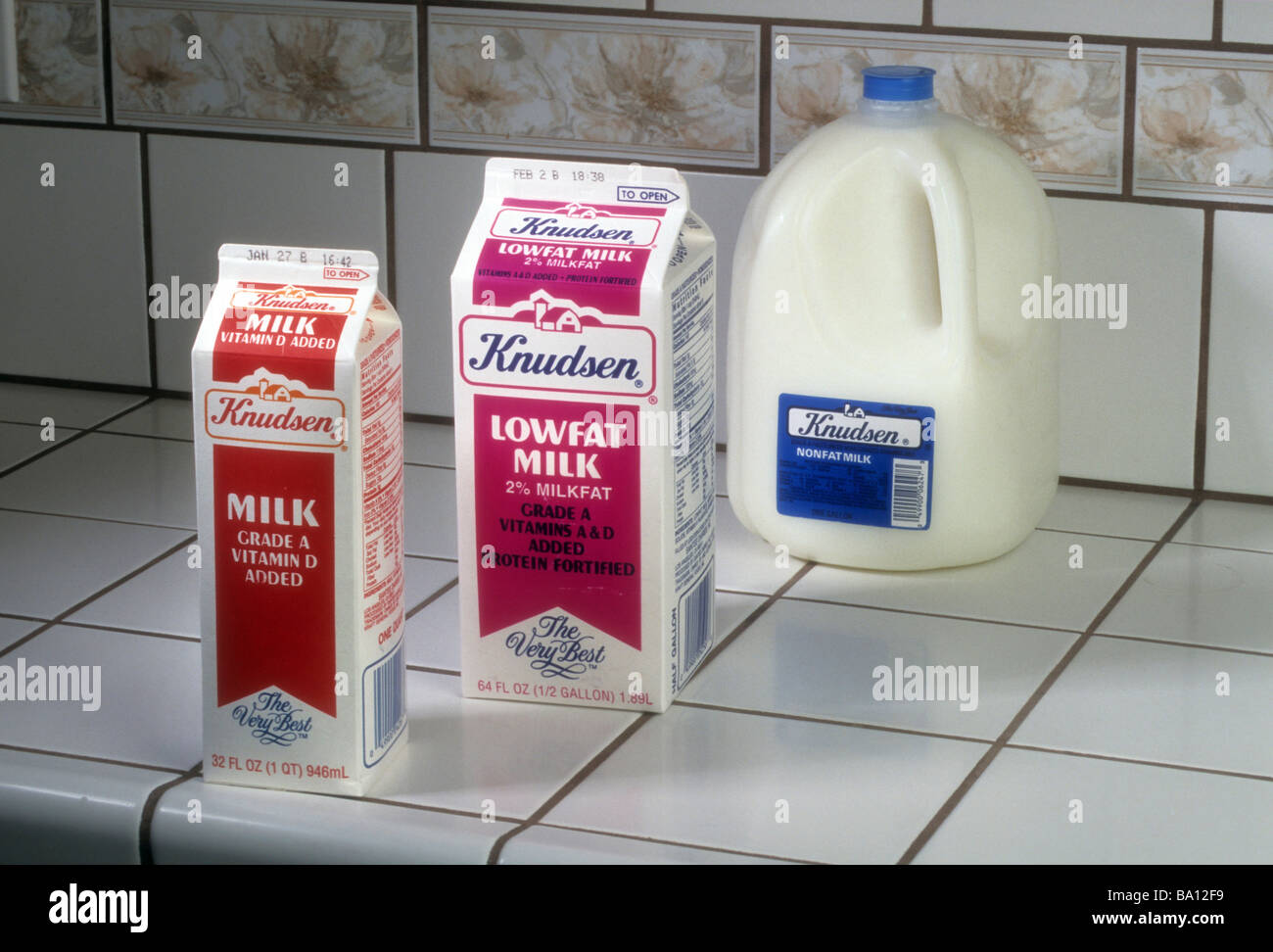 Milk non-fat 1% 2% whole homogenized drink beverage dairy vary size carton bottle plastic cardboard contain type food health Stock Photo