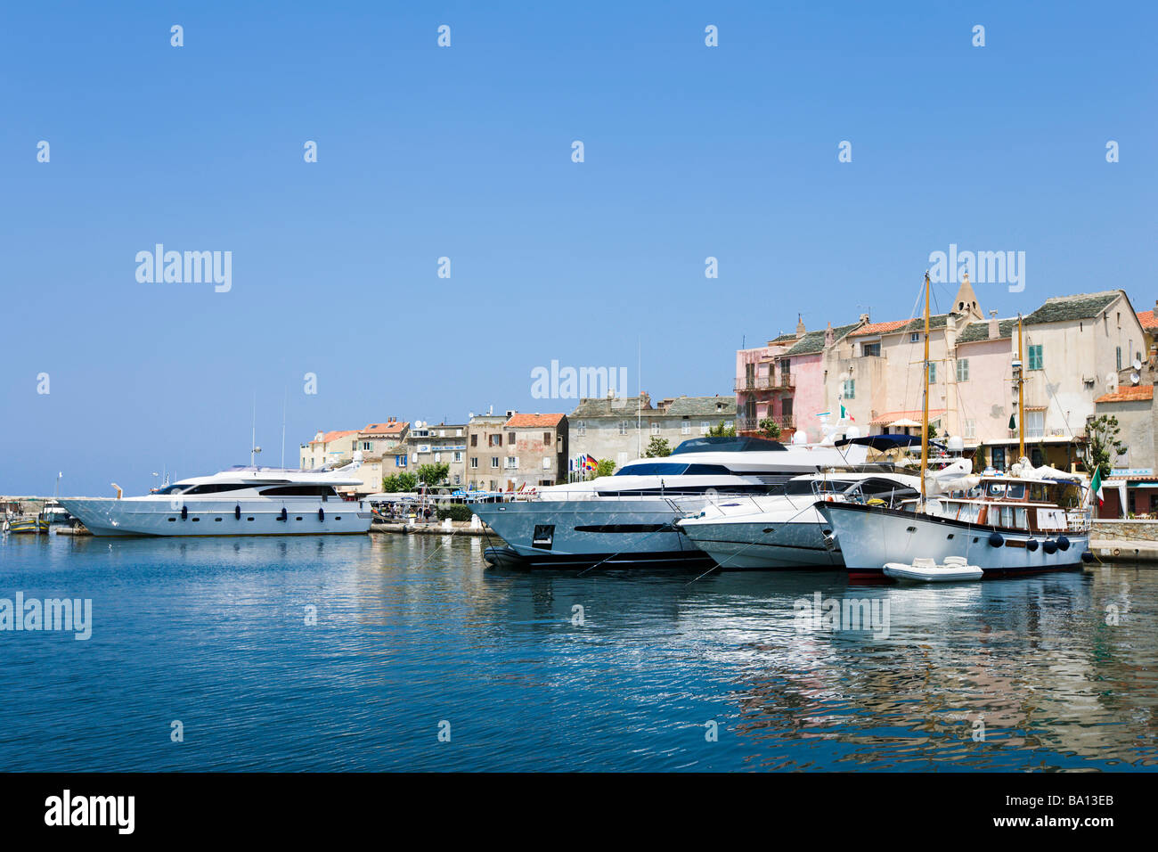 Luxury Yachts in the harbour at St Florent, The Nebbio, Corsica, France Stock Photo
