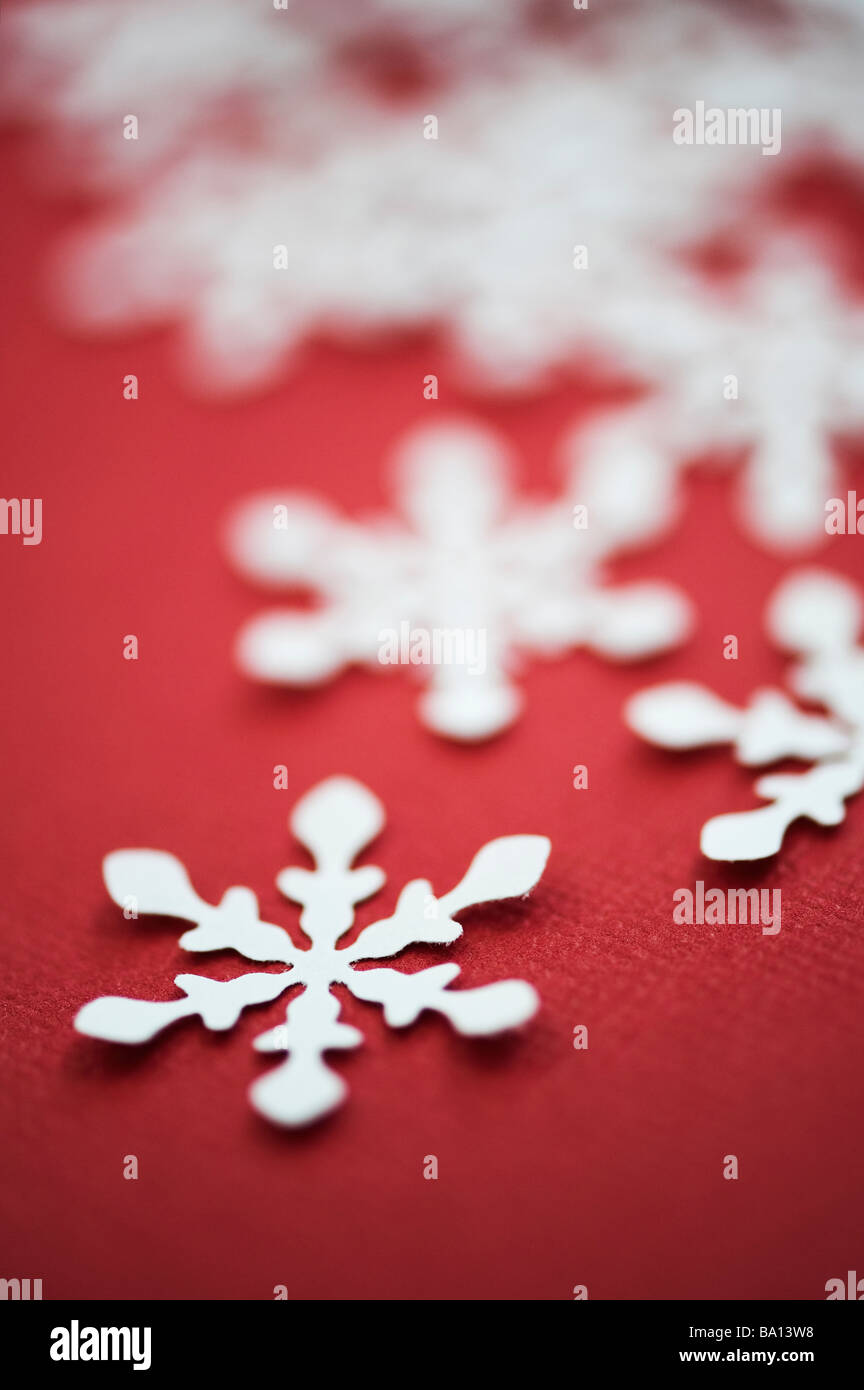 Paper snowflakes on a red background Stock Photo