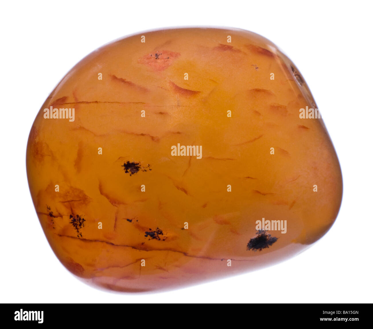 Carnelian tumblestone - orange form of Chalcedony Stock Photo