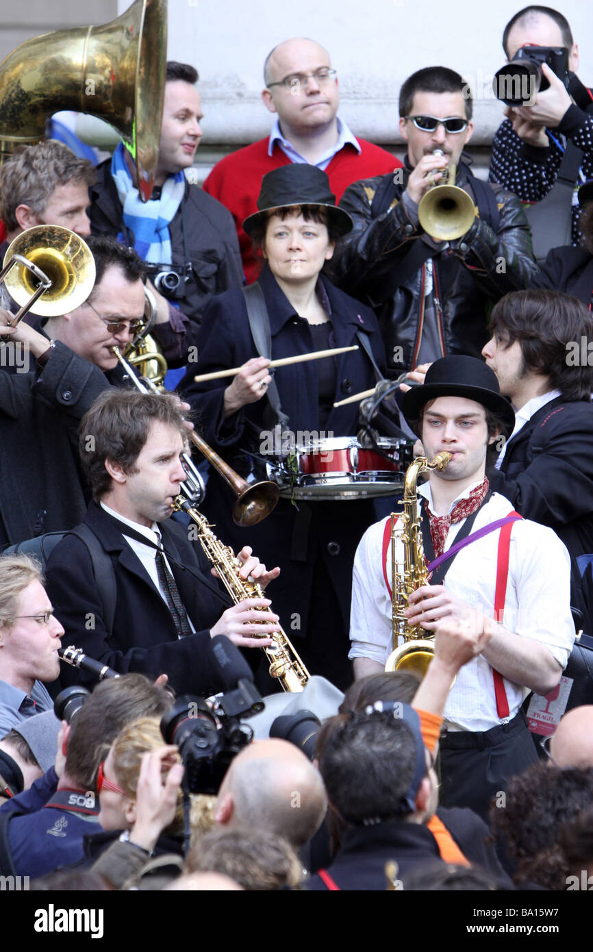 A brass band playing at the G20 protests in London Stock Photo