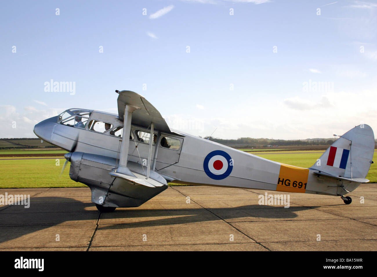 A De Havilland DH89A Rapide Dominie G-AIYR painted as HG691 in silver RAF training scheme Stock Photo