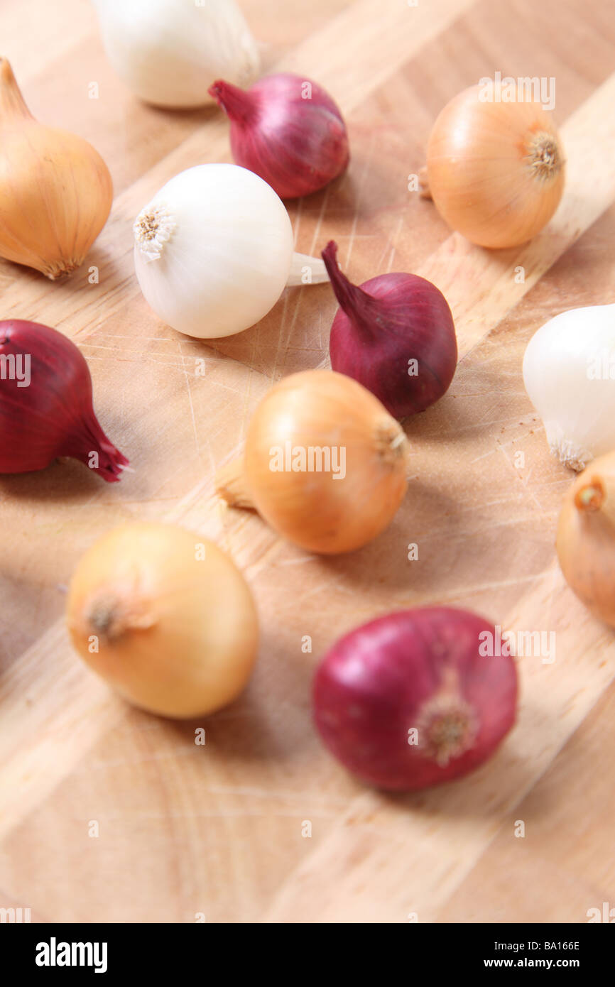 Pearl Onions on wooden surface Stock Photo