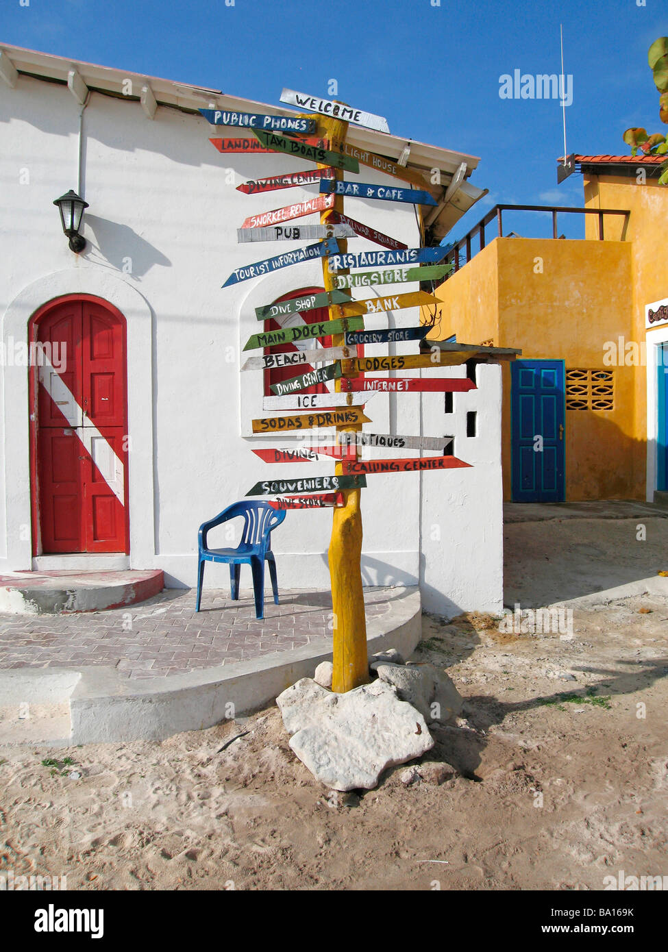 colorful sign post in front of dive shop Los Roques Venezuela South America Stock Photo