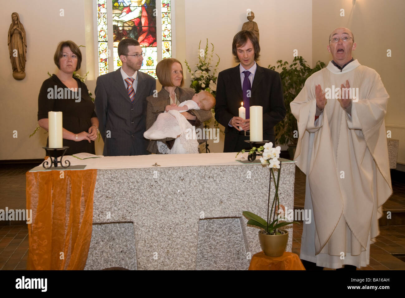 Christening godfather godmother godparents hires stock photography and