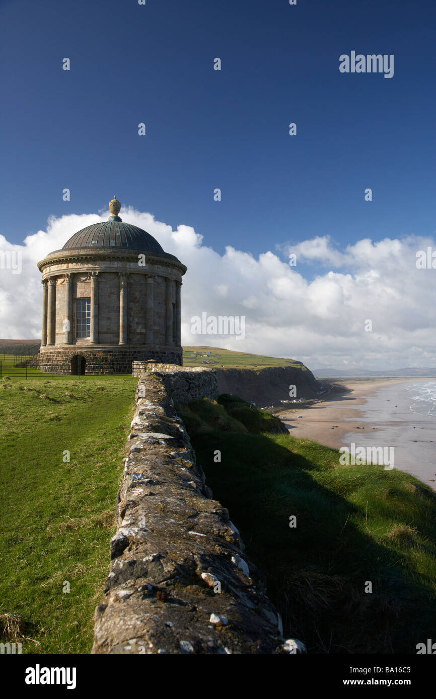 Mussenden Temple on the clifftop overlooking benone beach and downhill