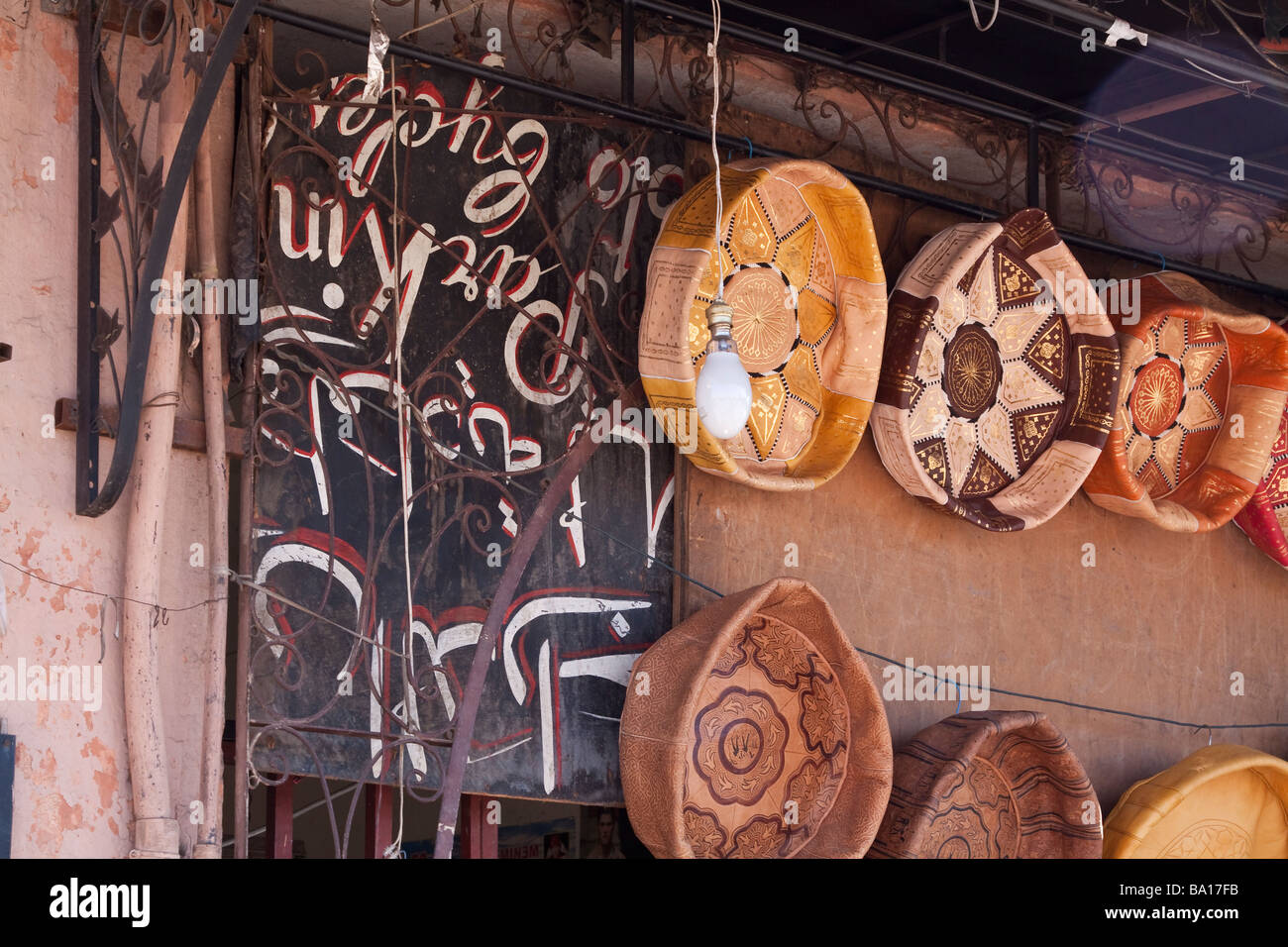 Traditional islamic patterned leather goods and crafts for sale on the exterior of a stall near the place Jemaa El Fna Stock Photo