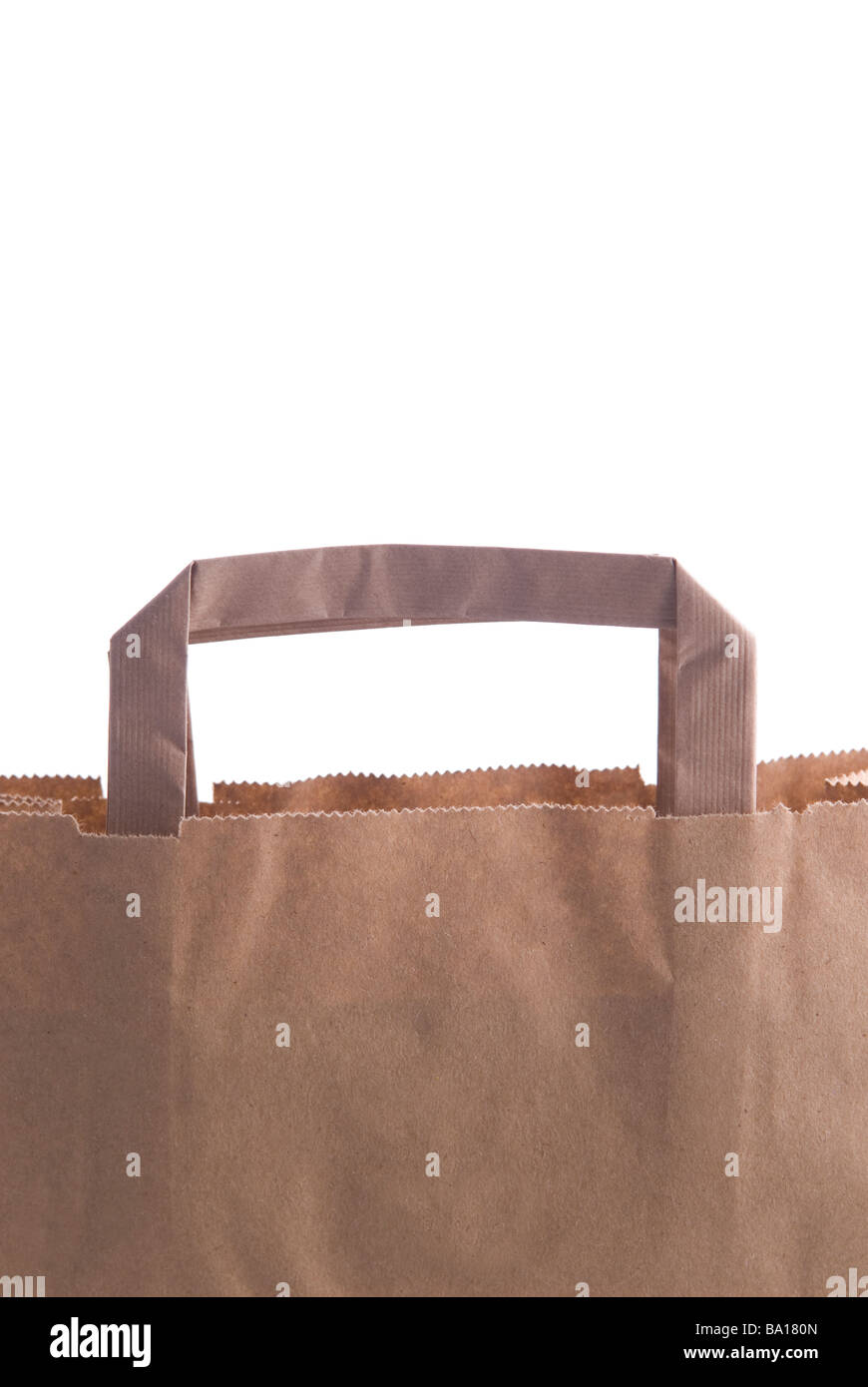Handle of a brown paper shopping bag isolated against a white background Stock Photo