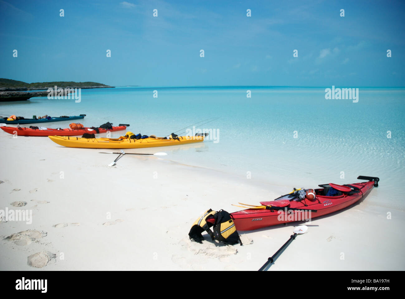 sea kayaks on the beach of the exuma islands bahamas Stock Photo