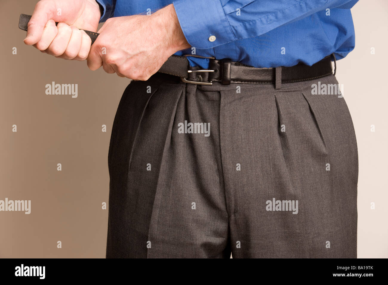 Tighten belt hires stock photography and images Alamy