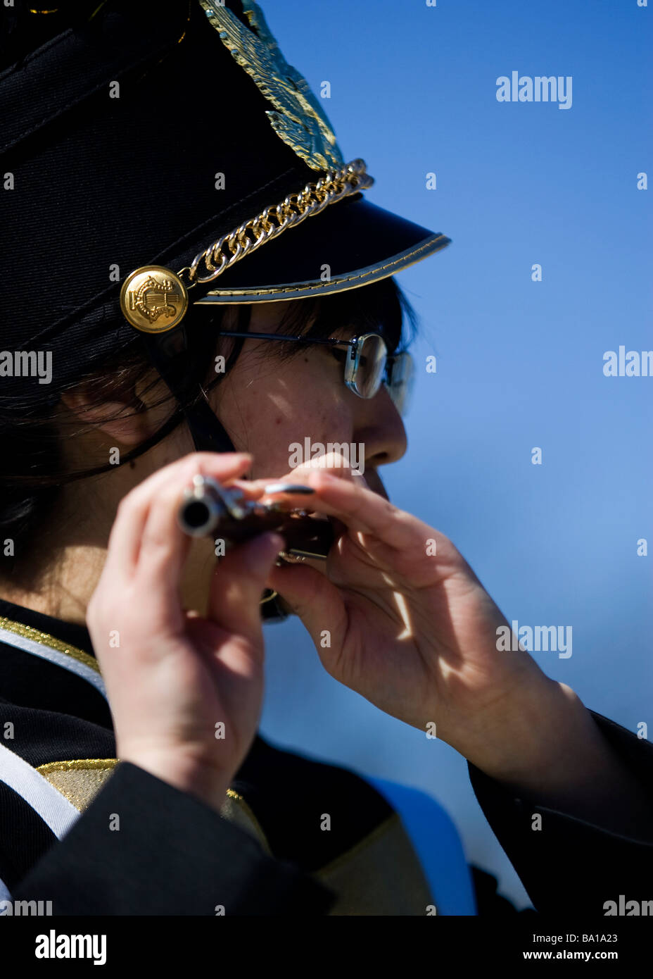 Asian female flute player in high school marching band Stock Photo