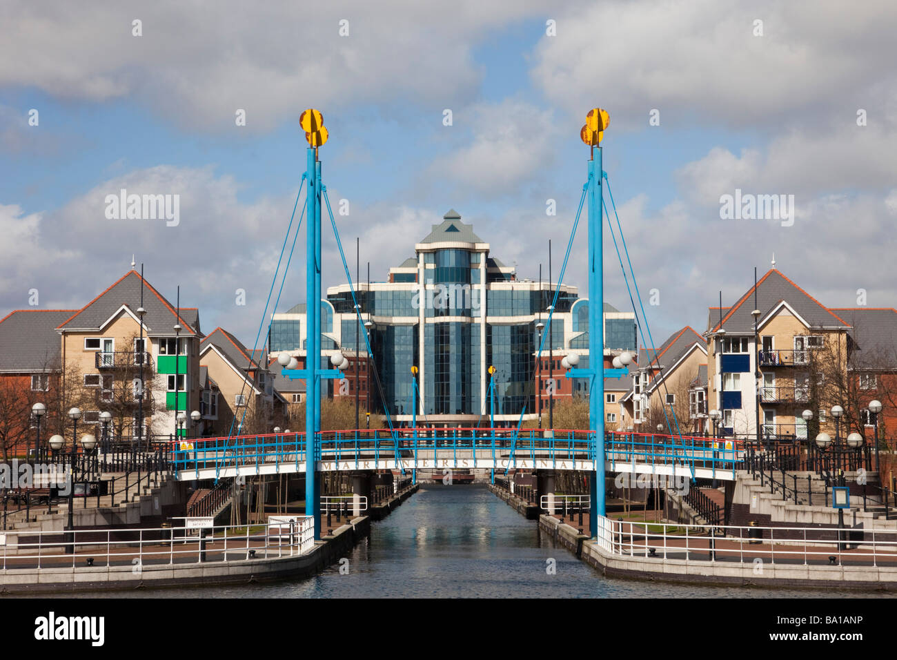 Salford Quays Greater Manchester England UK Victoria Harbour building beyond Mariner's Canal footbridge on Manchester Ship Canal Stock Photo