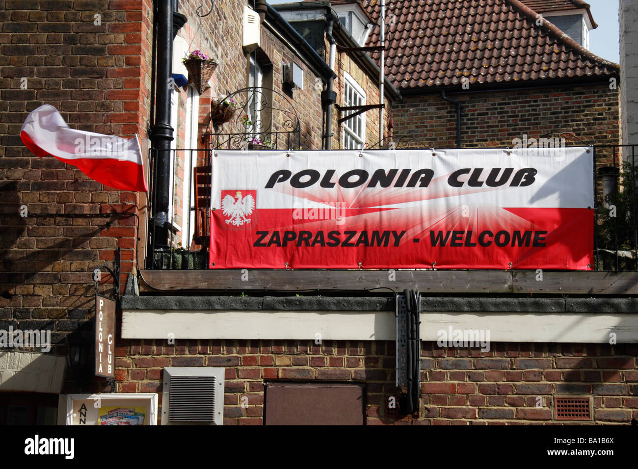 A Polish flag and sign outside a Polish club in Richmond Upon Thames, Surrey, UK. Stock Photo